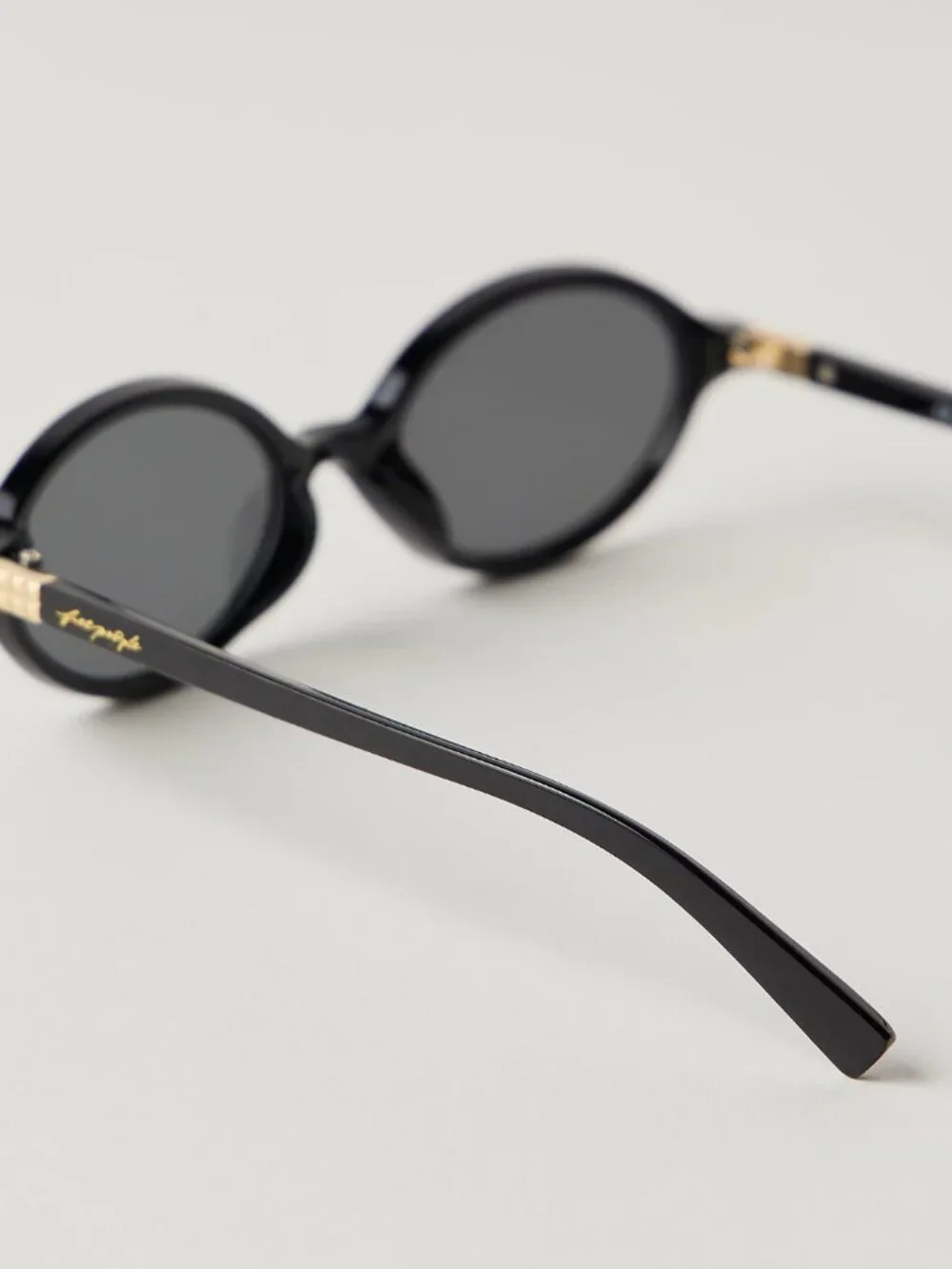 Free People Black Oval Sunglasses with Slim Frame